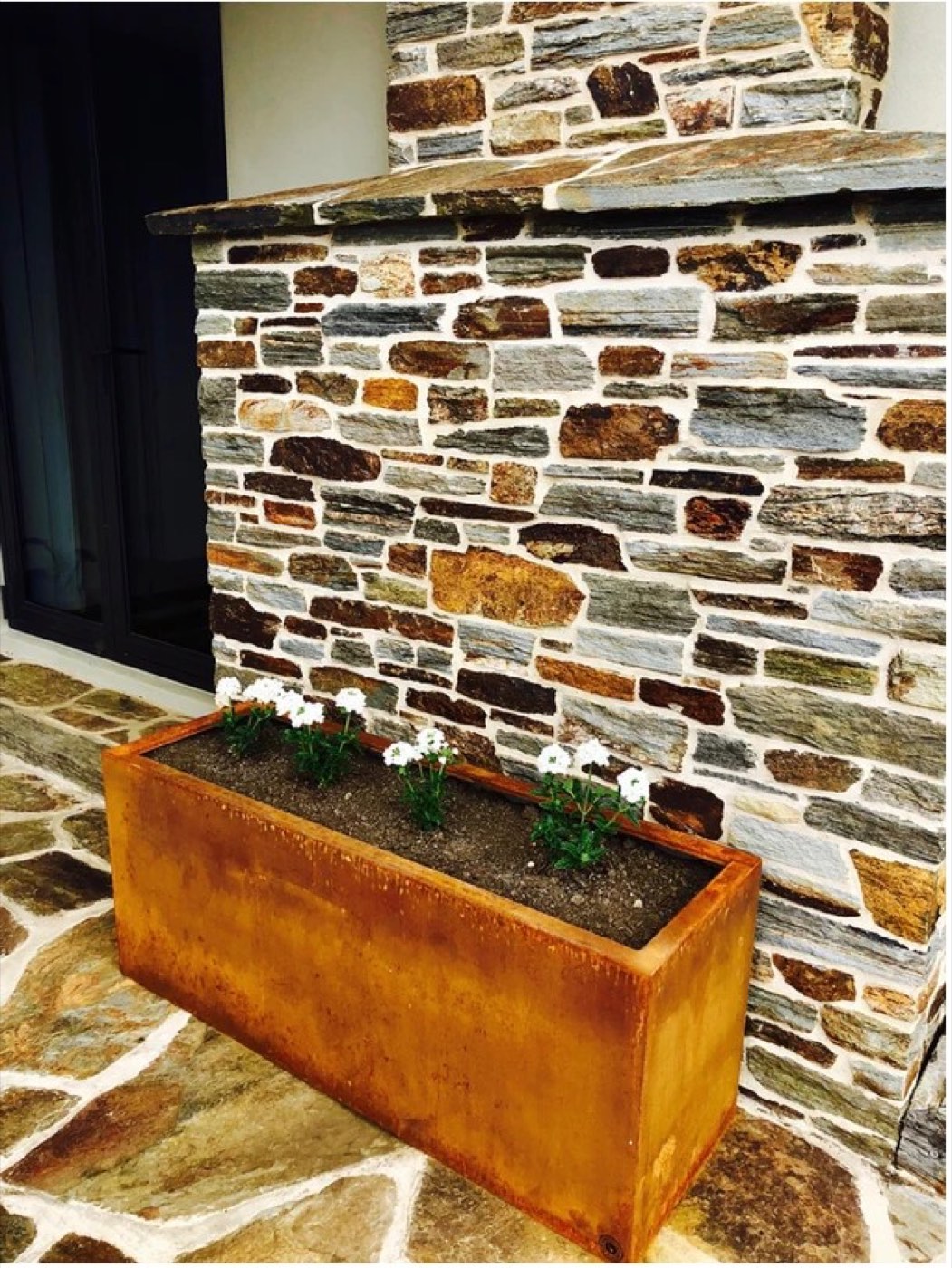 A single rectangular corten planter box.